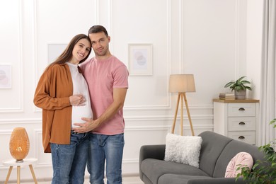 Photo of Pregnant woman and her husband at home