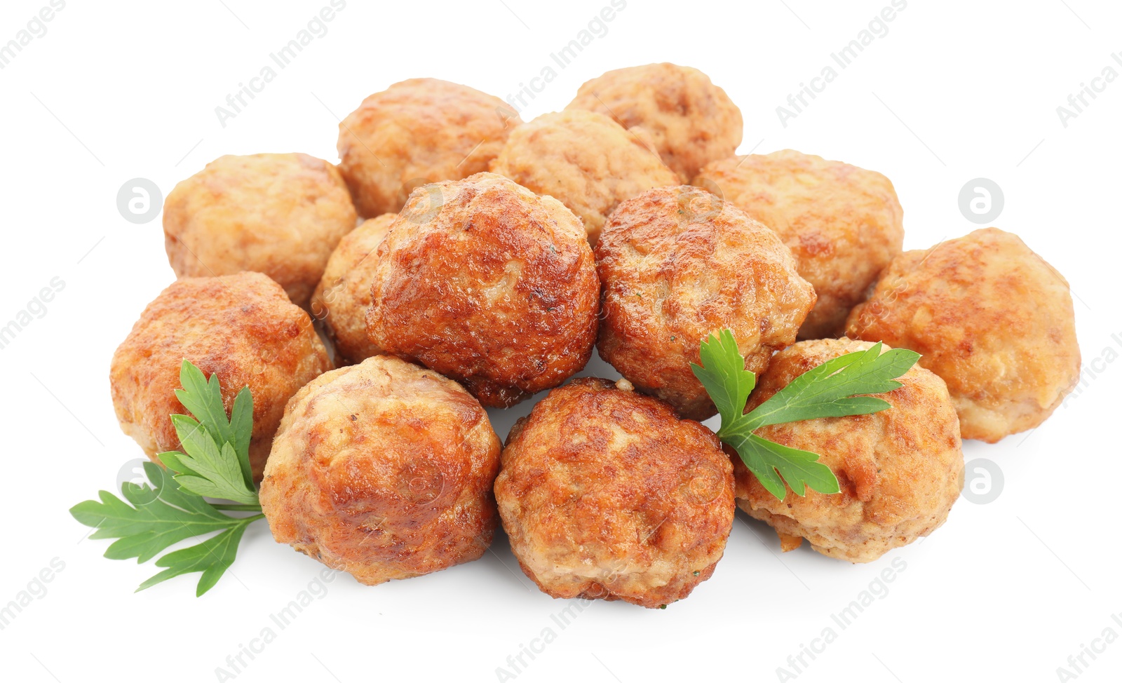 Photo of Pile of delicious meatballs and parsley isolated on white