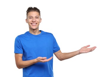 Photo of Happy man welcoming friends or guests on white background