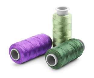 Photo of Spools of bright sewing threads isolated on white