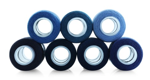 Photo of Spools of bright sewing threads isolated on white