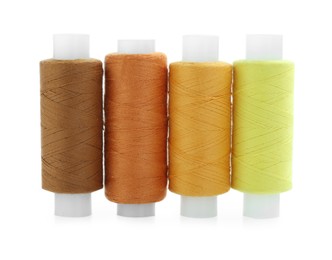 Photo of Spools of bright sewing threads isolated on white