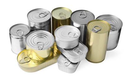 Photo of Many closed tin cans isolated on white