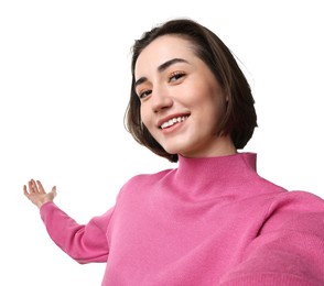 Photo of Cheerful woman welcoming friends or guests via video call on white background