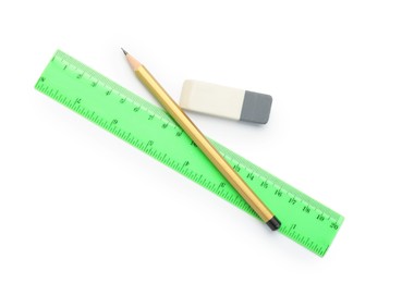 Eraser, ruler and pencil isolated on white, top view