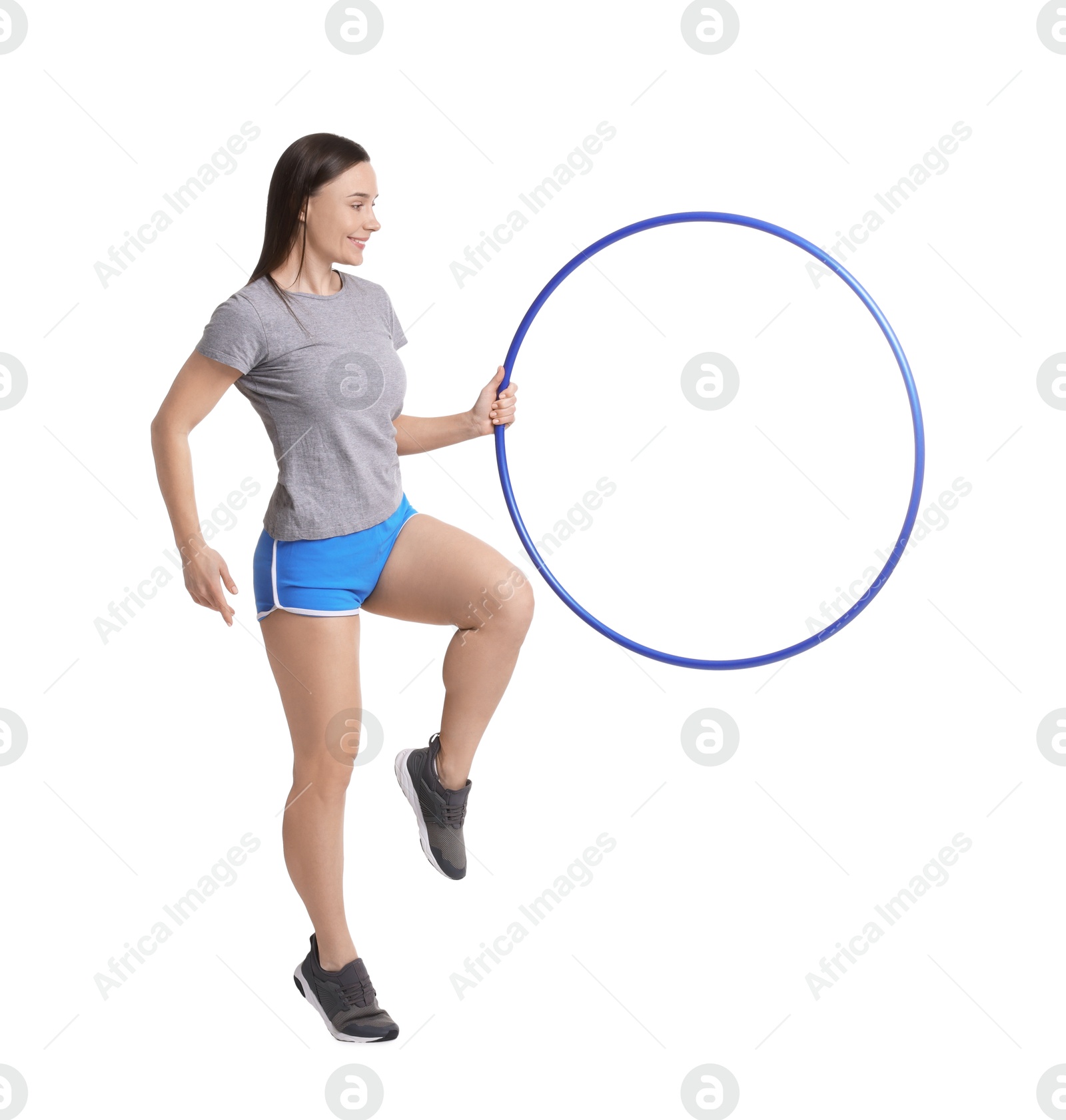 Photo of Smiling woman with hula hoop on white background