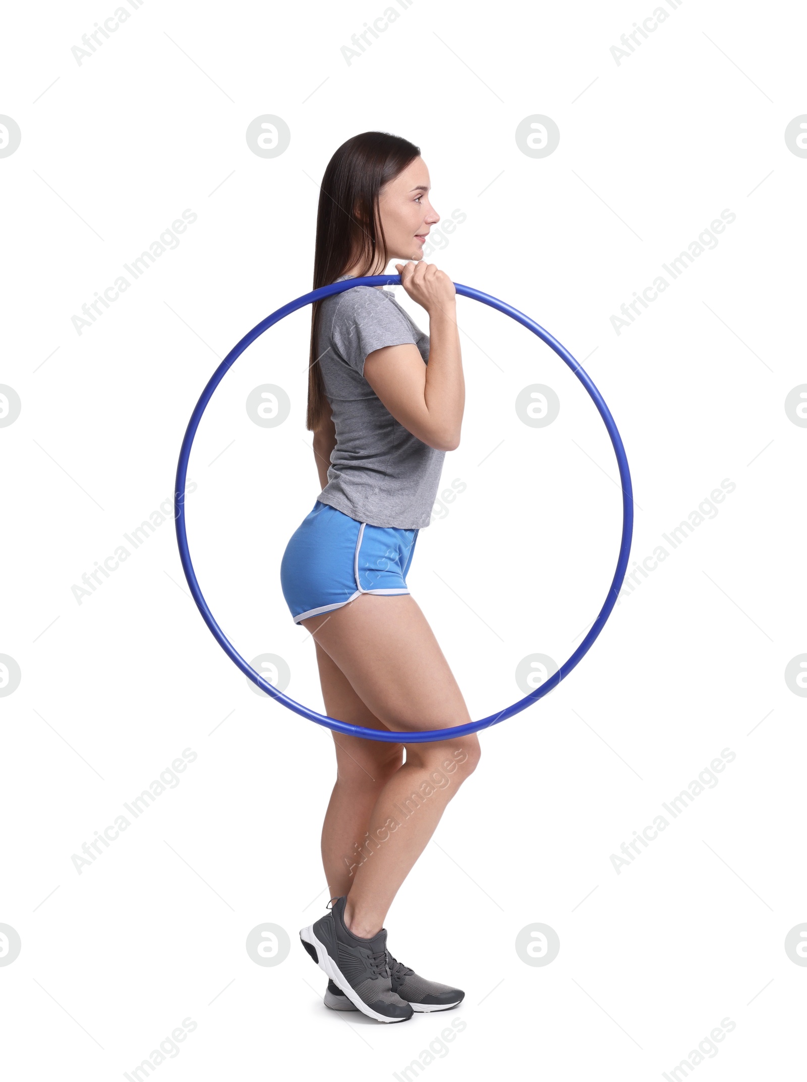 Photo of Beautiful woman with hula hoop on white background