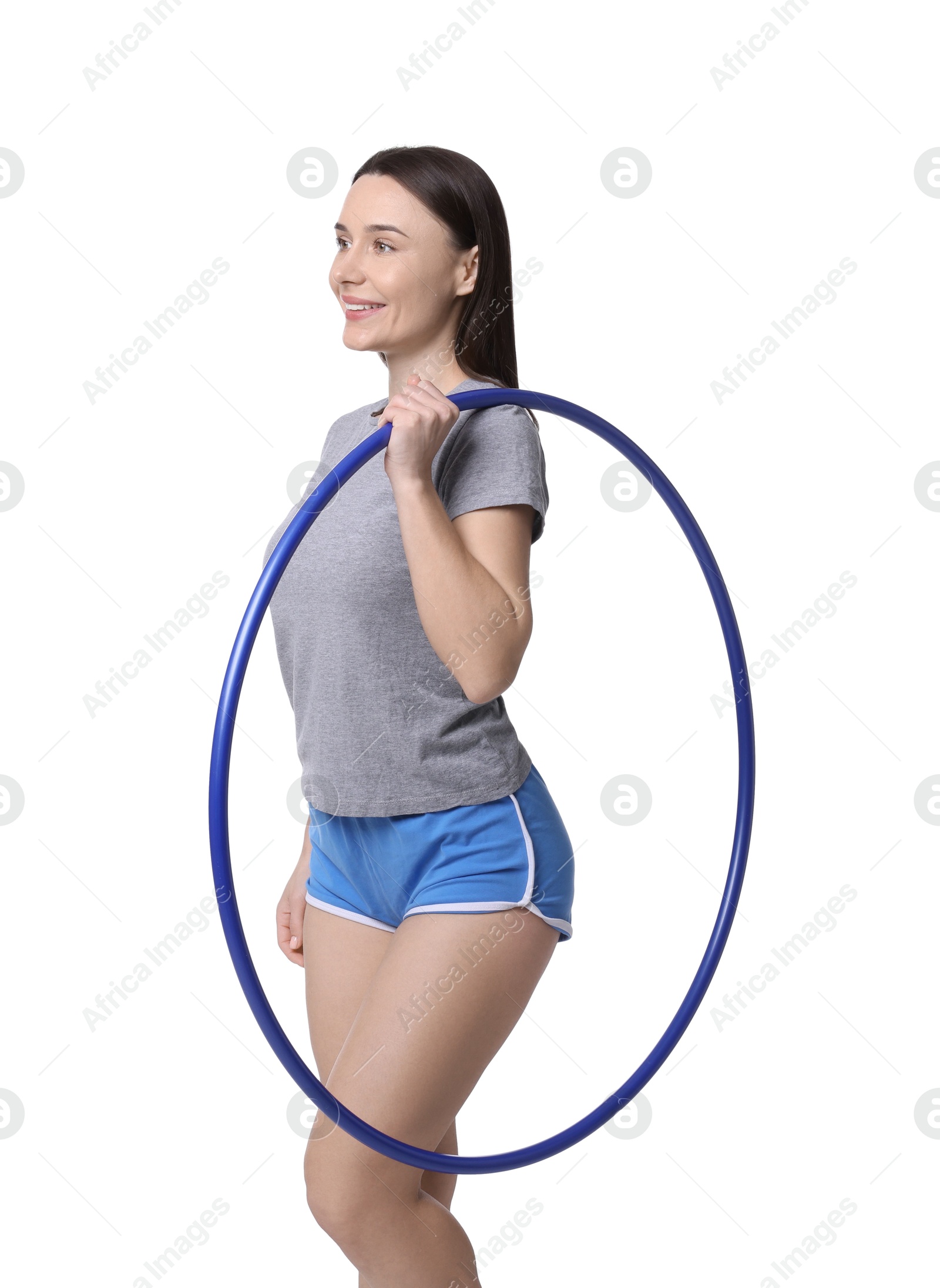 Photo of Smiling woman with hula hoop on white background