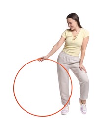 Photo of Smiling woman with hula hoop on white background