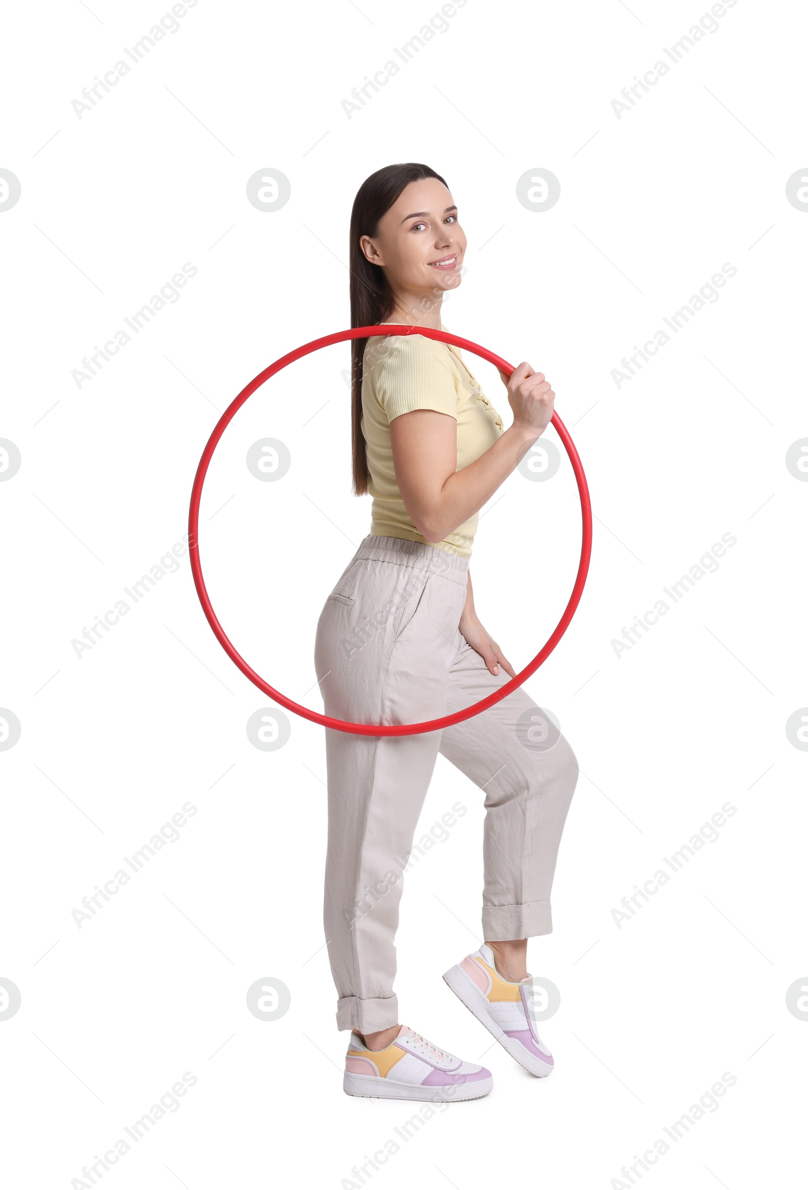 Photo of Smiling woman with hula hoop on white background