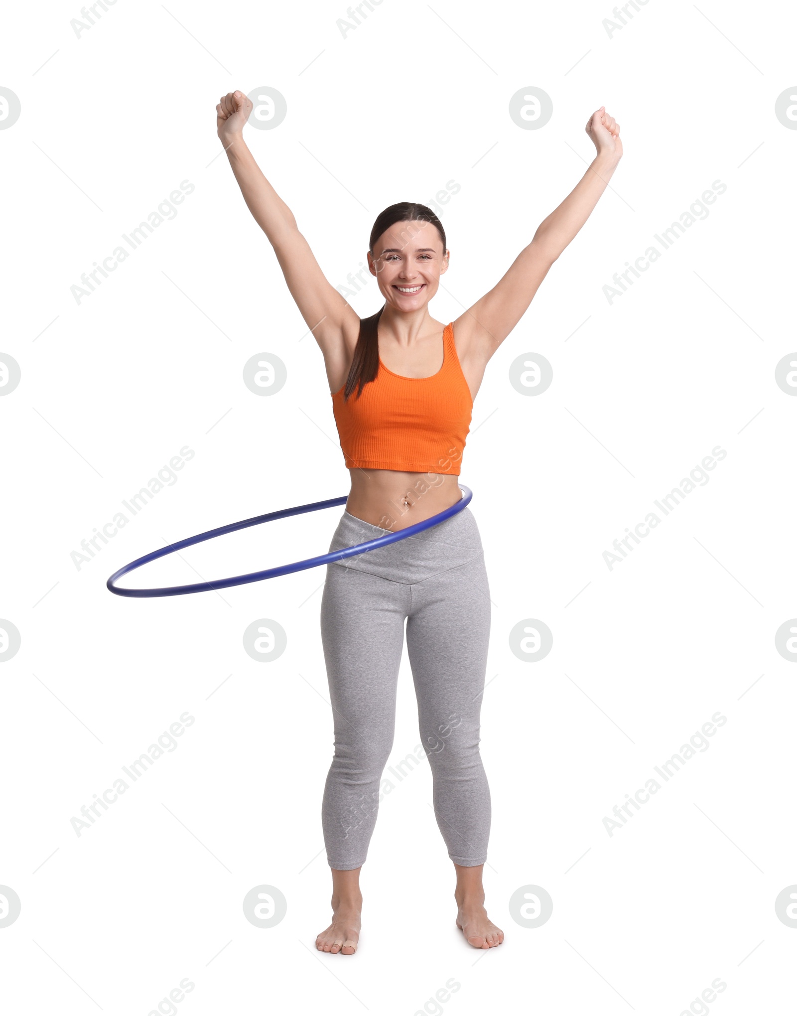 Photo of Smiling woman training with hula hoop on white background