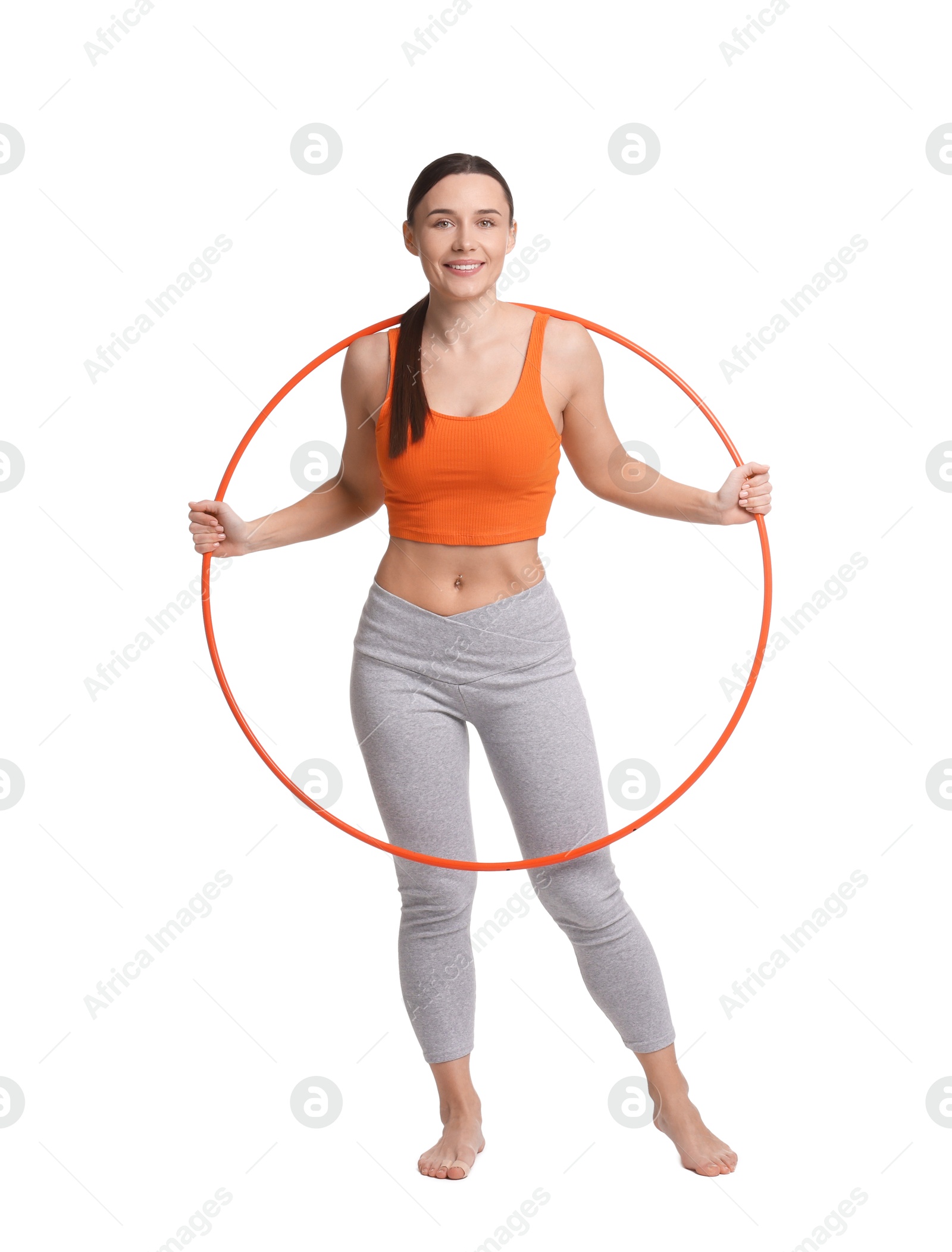 Photo of Smiling woman with hula hoop on white background