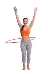 Photo of Smiling woman training with hula hoop on white background