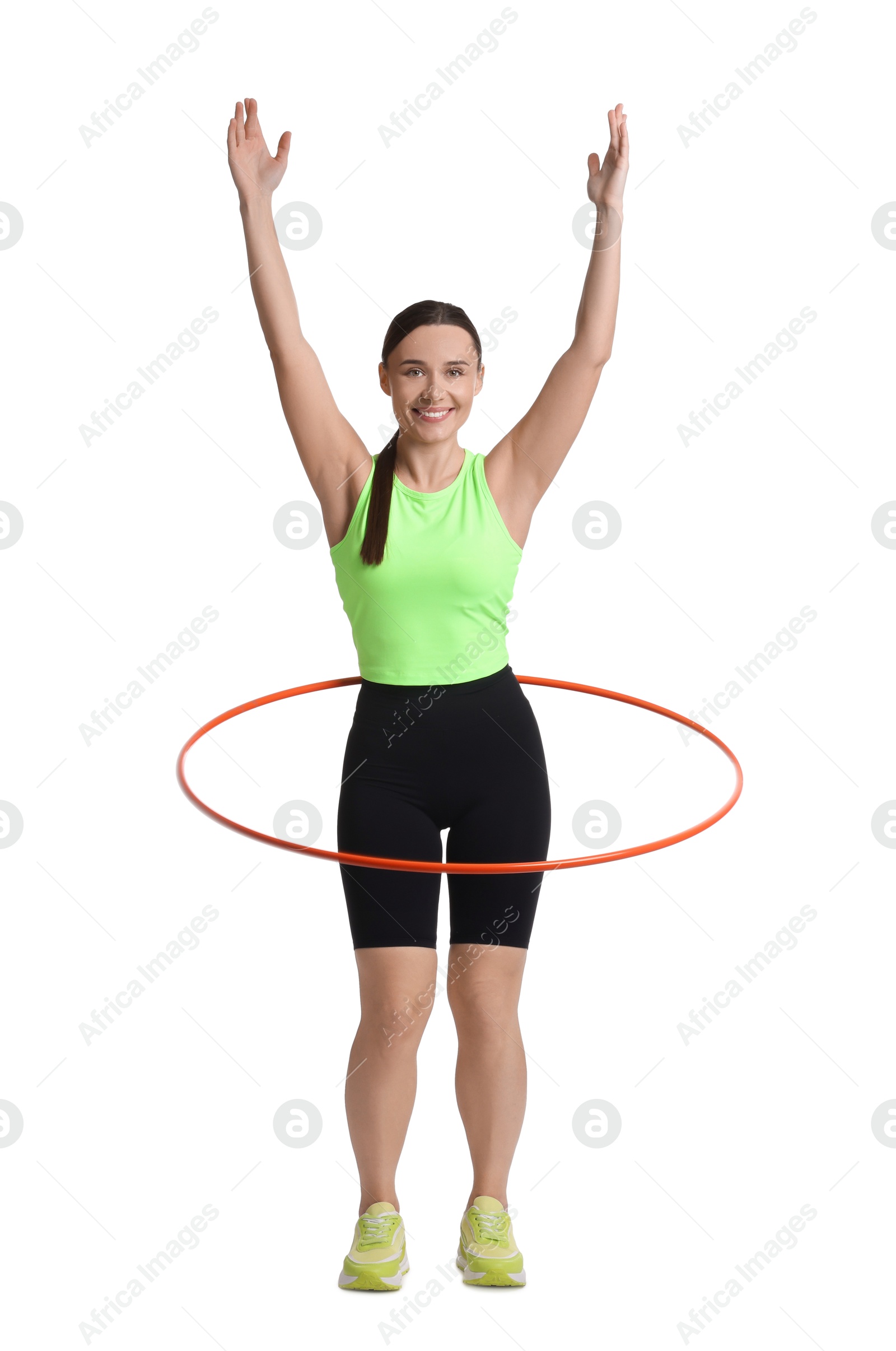 Photo of Smiling woman training with hula hoop on white background