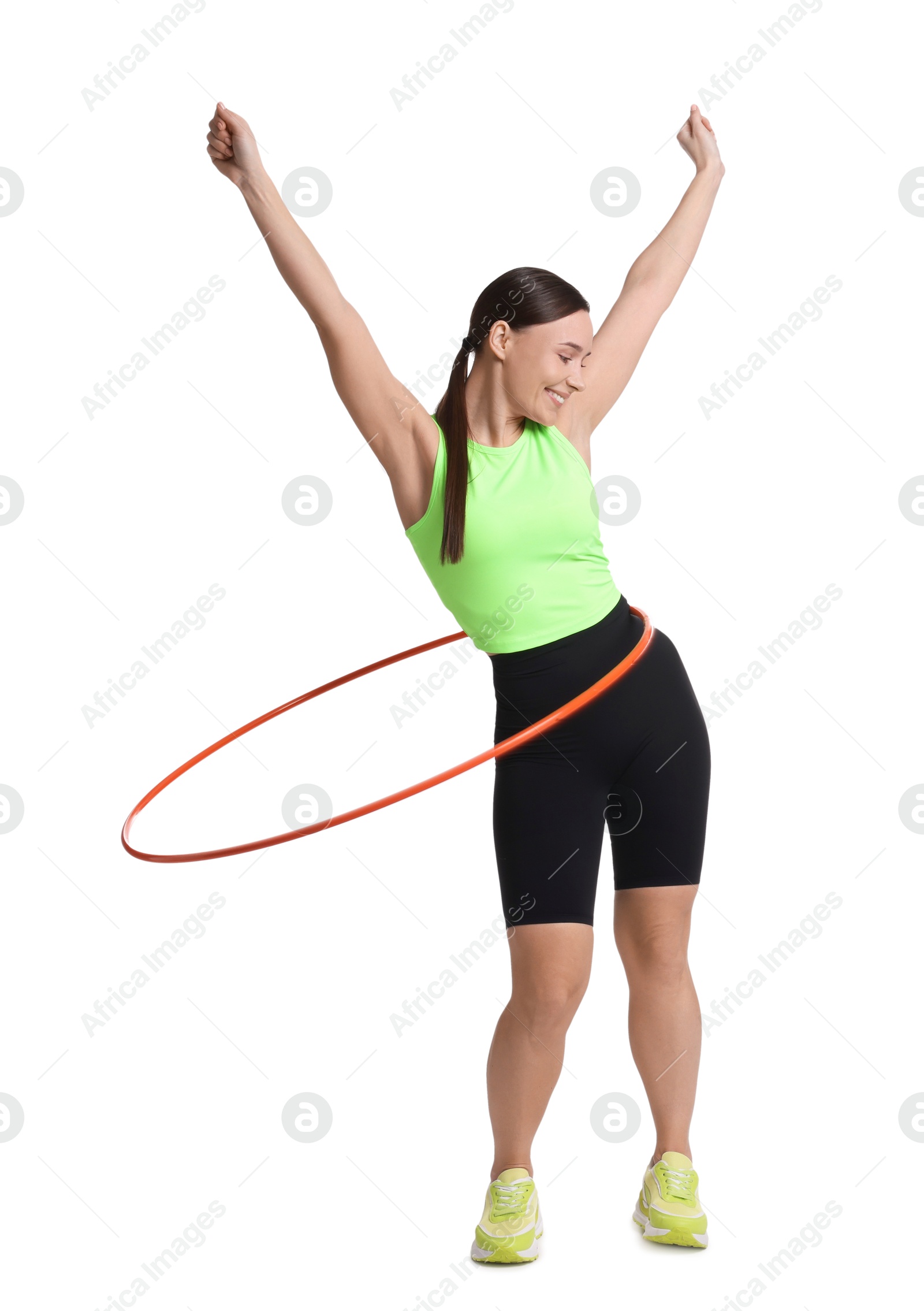 Photo of Smiling woman training with hula hoop on white background