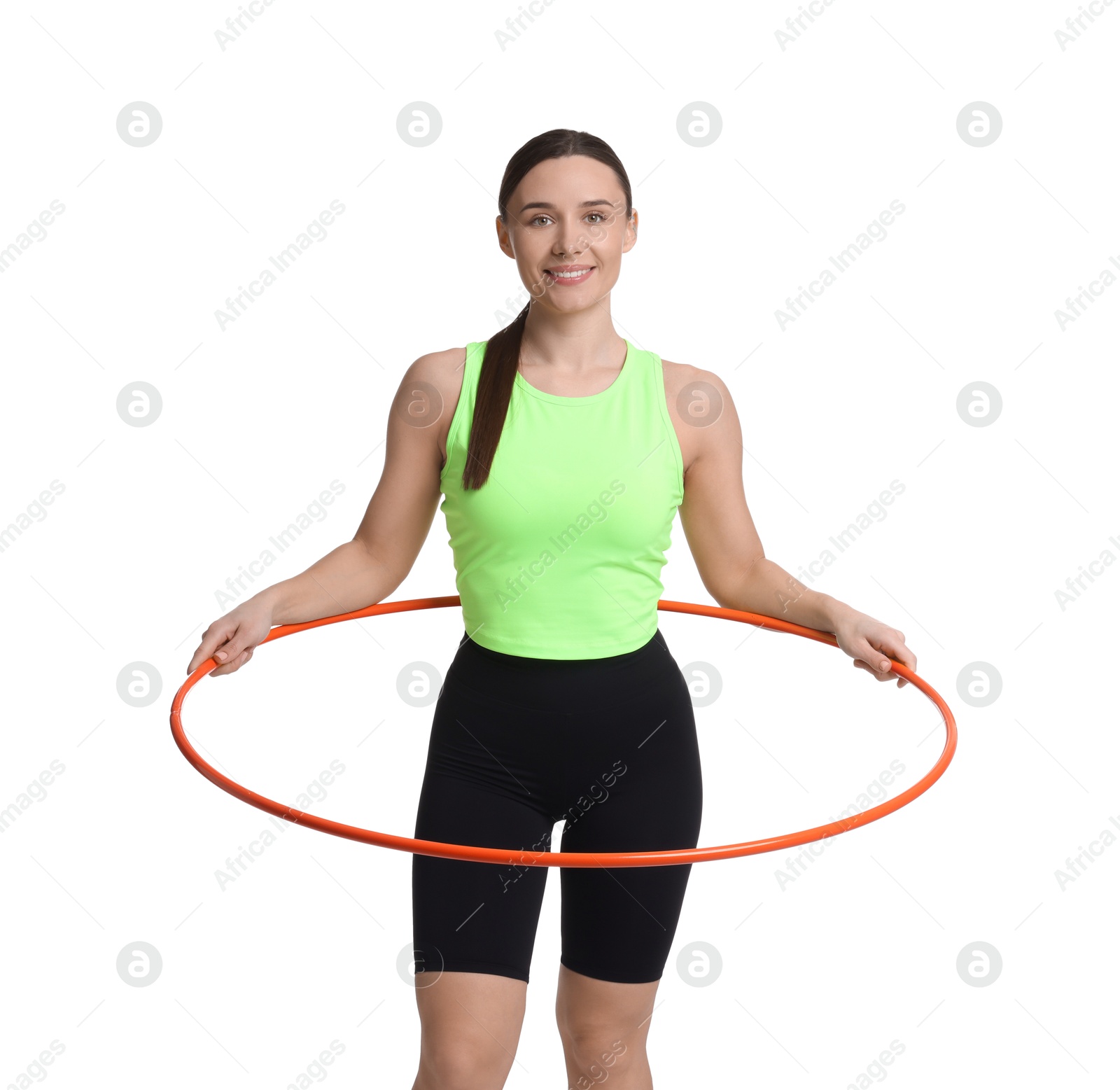 Photo of Smiling woman training with hula hoop on white background