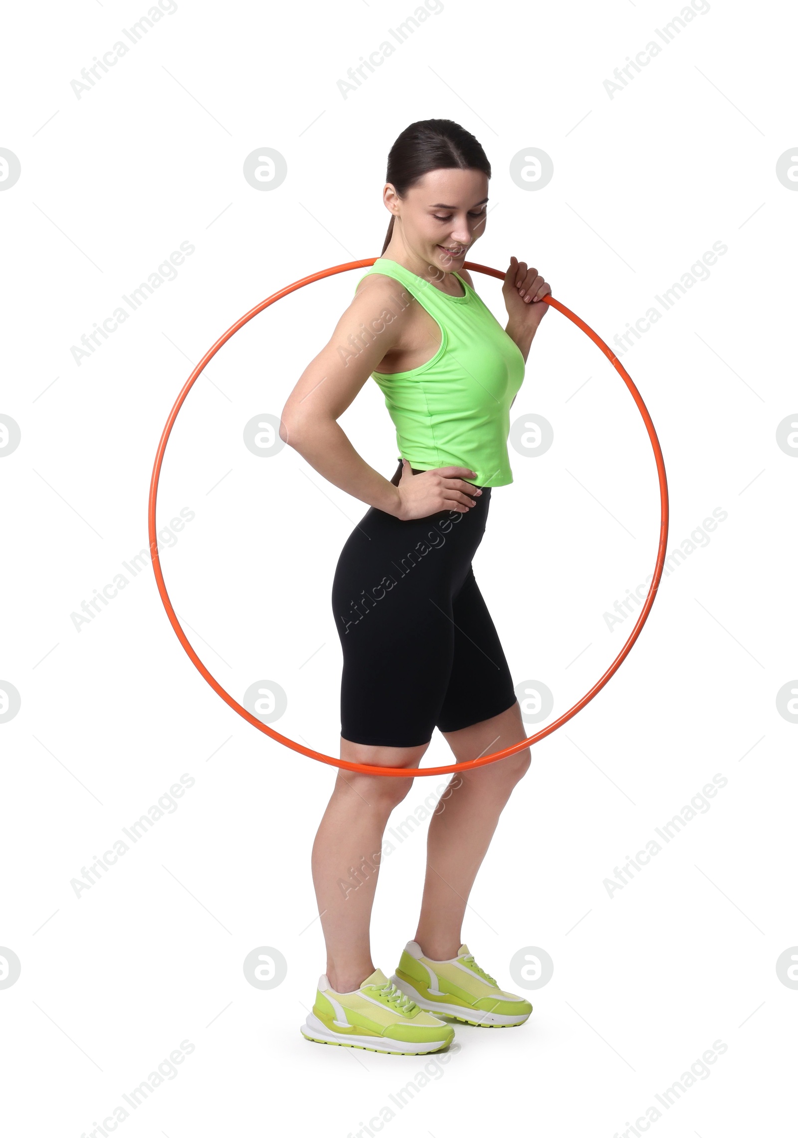 Photo of Smiling woman with hula hoop on white background