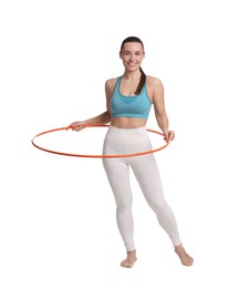 Photo of Smiling woman training with hula hoop on white background