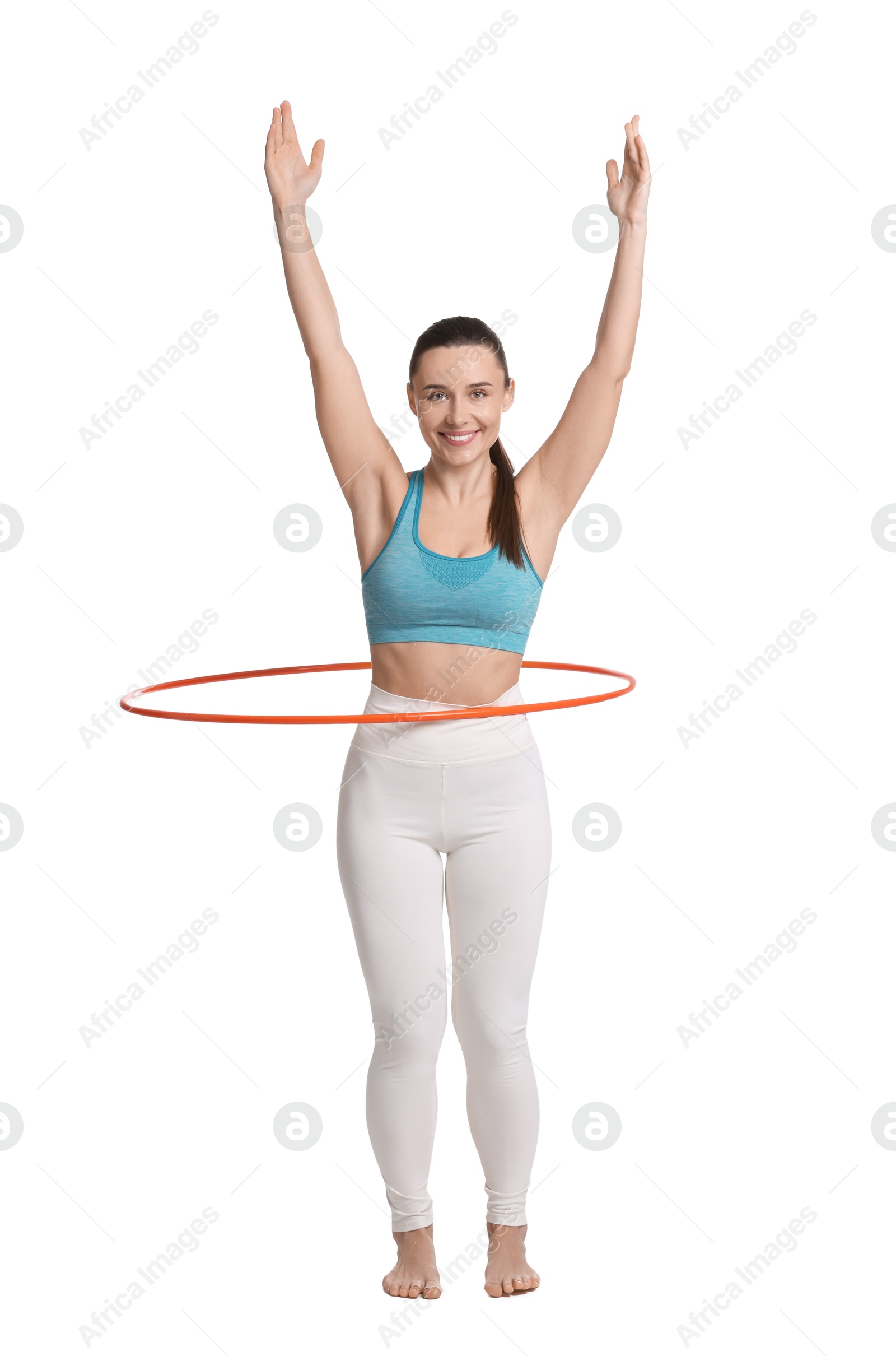 Photo of Smiling woman training with hula hoop on white background