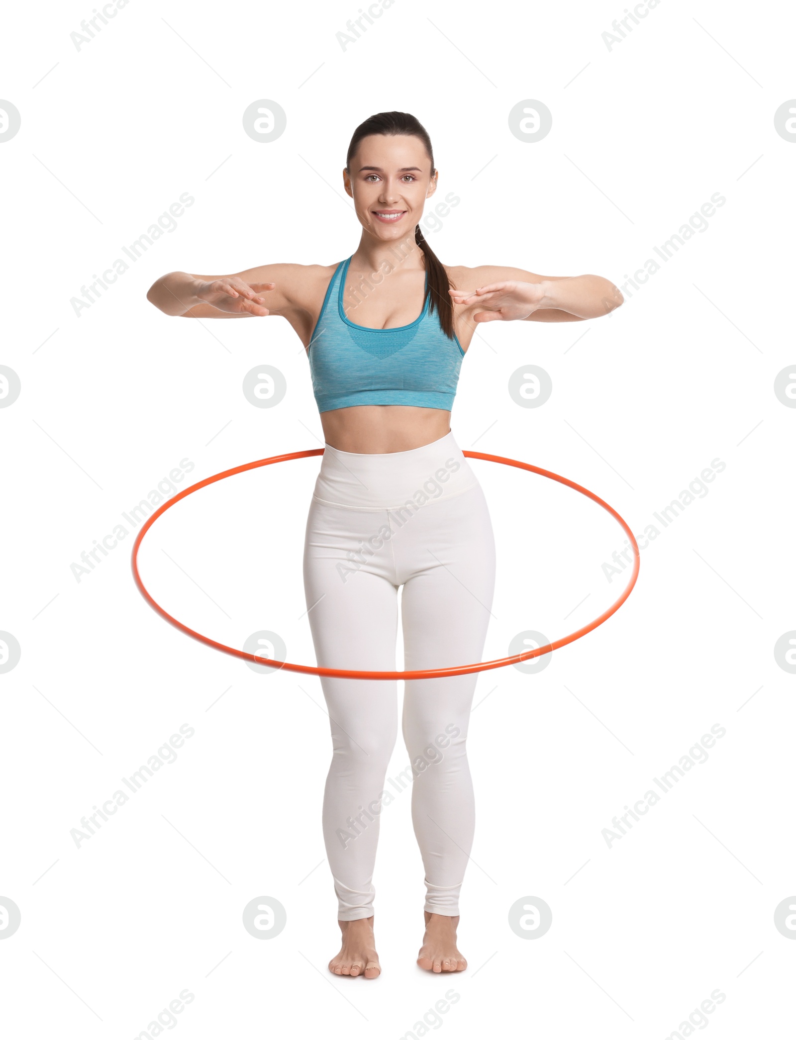 Photo of Smiling woman training with hula hoop on white background