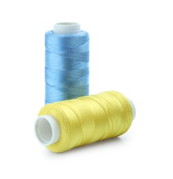 Photo of Spools of bright sewing threads isolated on white