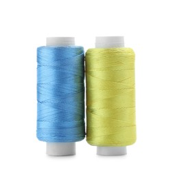 Photo of Spools of bright sewing threads isolated on white