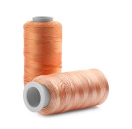 Photo of Spools of bright sewing threads isolated on white