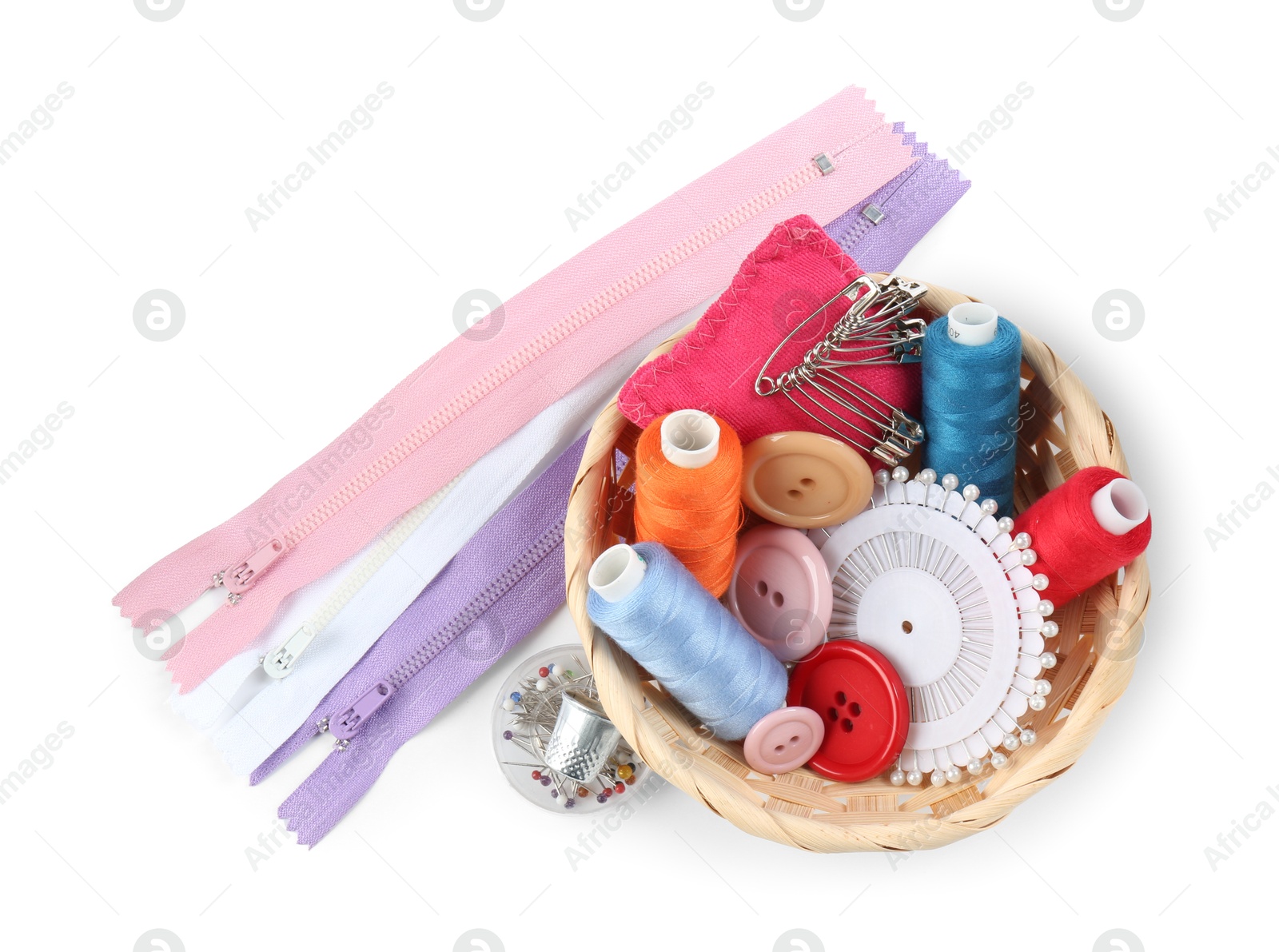 Photo of Basket with sewing supplies isolated on white, top view