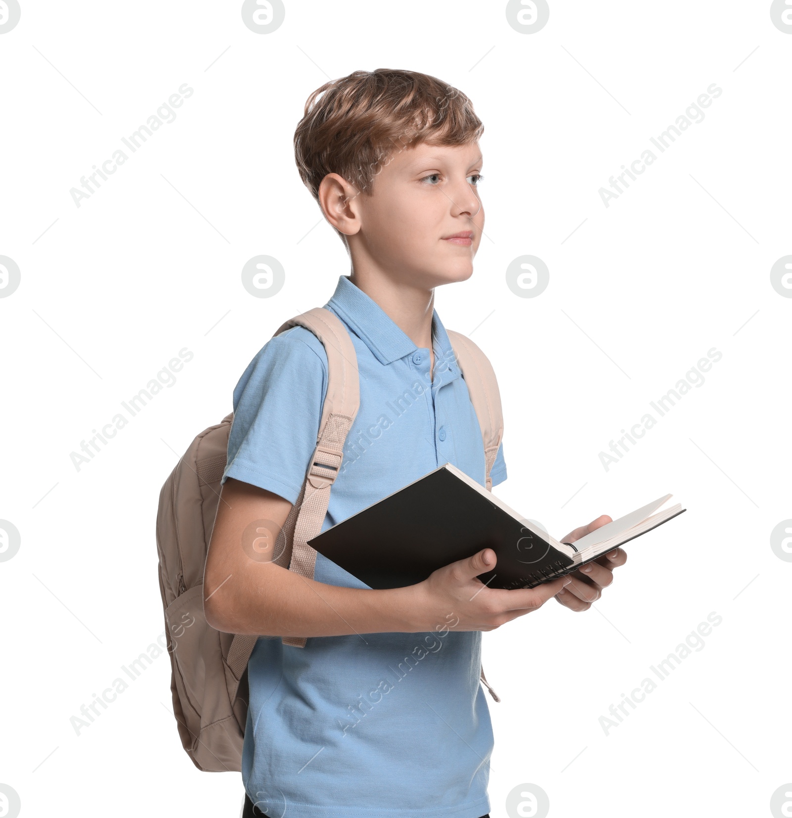 Photo of Portrait of teenage boy with notebook and backpack on white background