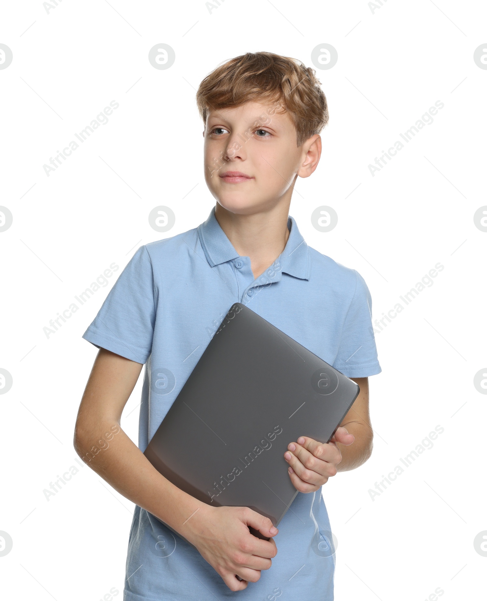 Photo of Portrait of teenage boy with laptop on white background