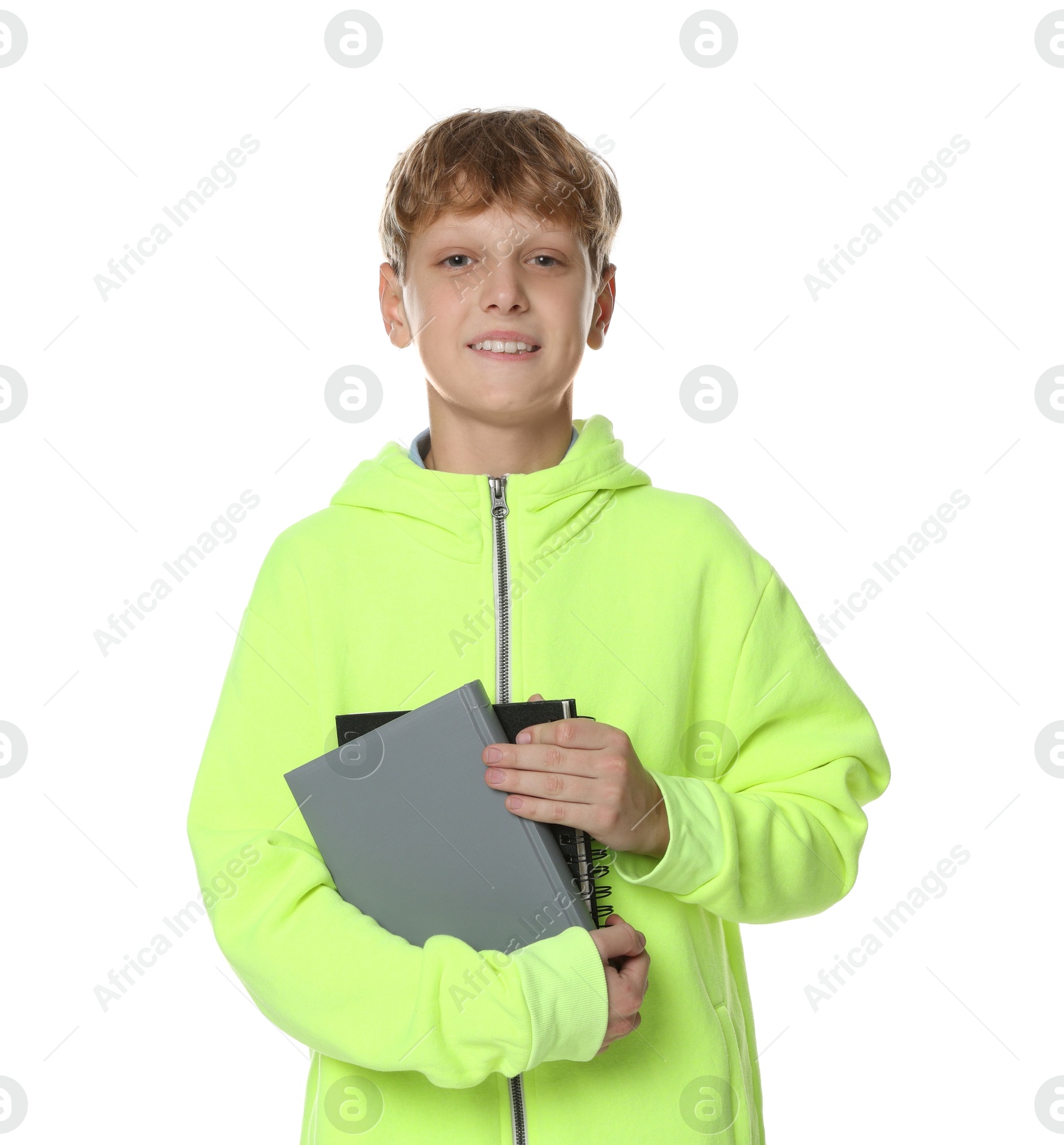 Photo of Portrait of teenage boy with books on white background