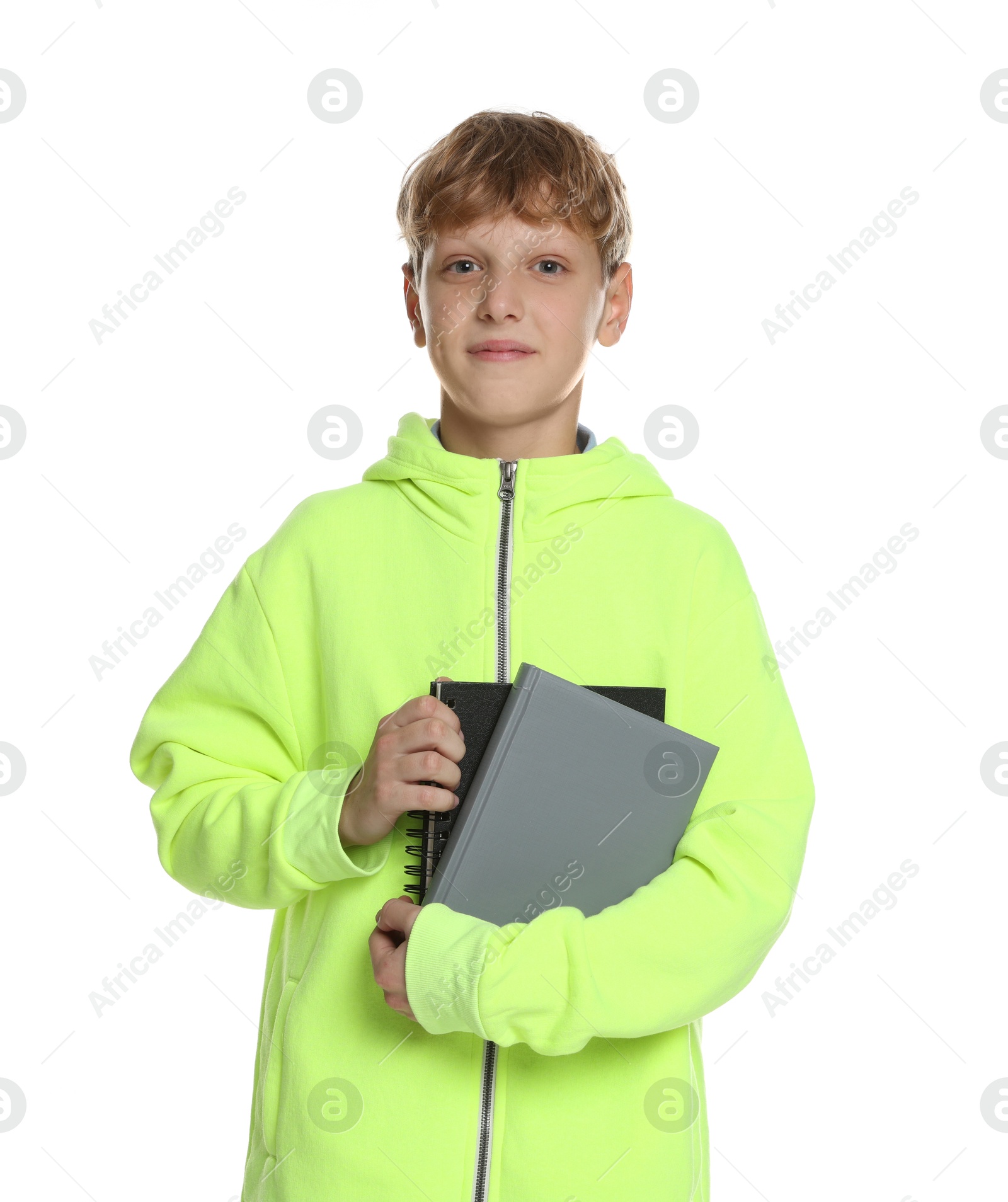 Photo of Portrait of teenage boy with books on white background