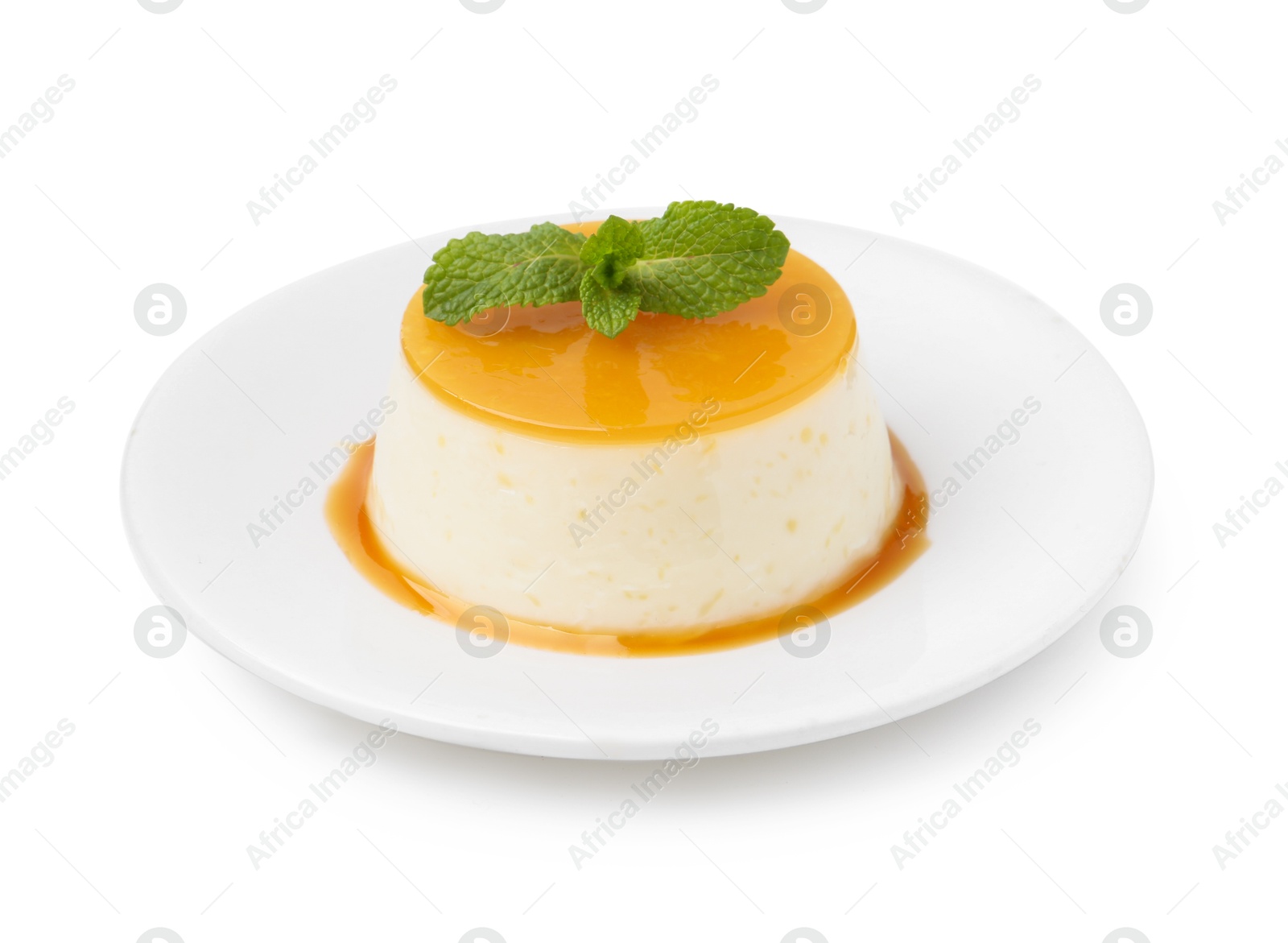 Photo of Tasty pudding with caramel sauce and mint isolated on white