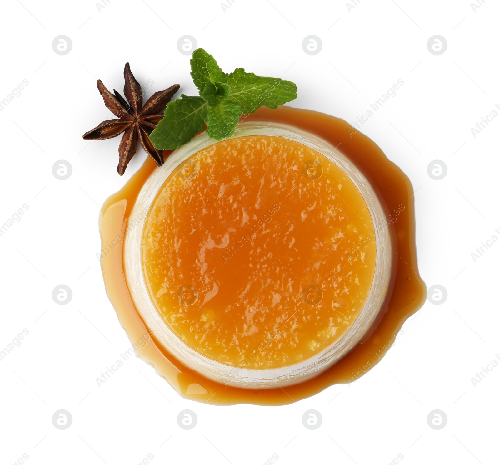 Photo of Tasty pudding with caramel sauce and mint isolated on white, top view