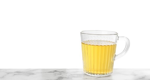 Refreshing green tea in cup on marble table against white background. Space for text