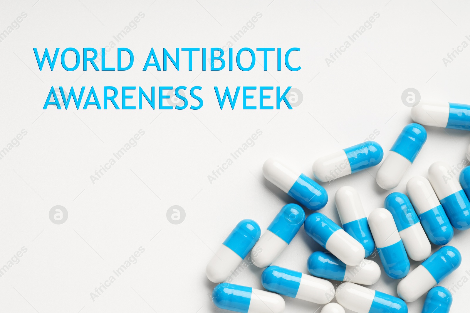 Image of World antibiotic awareness week. Many pills on white background, flat lay