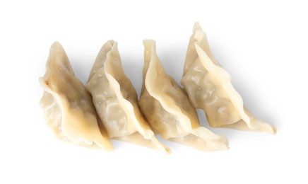 Photo of Tasty boiled gyoza (dumplings) isolated on white, top view