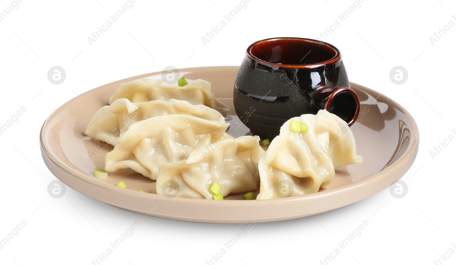 Photo of Tasty gyoza (dumplings) and soy sauce isolated on white