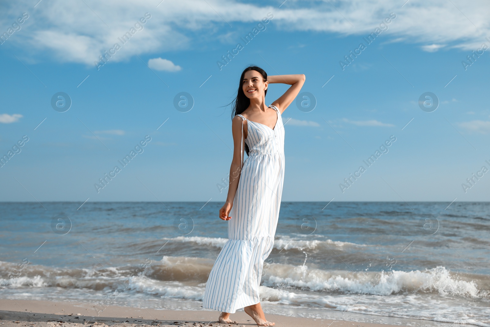 Photo of Young beautiful woman at beach on sunny day