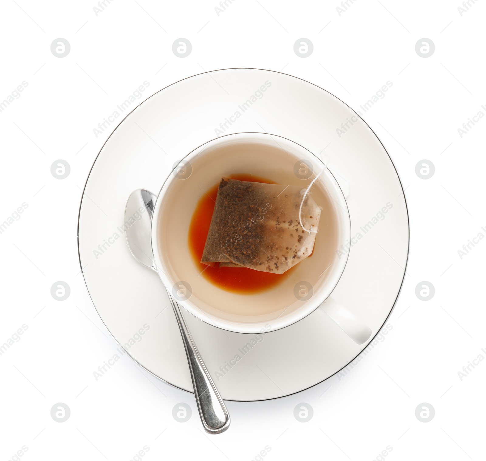 Photo of Tea bag in cup with hot drink isolated on white, top view