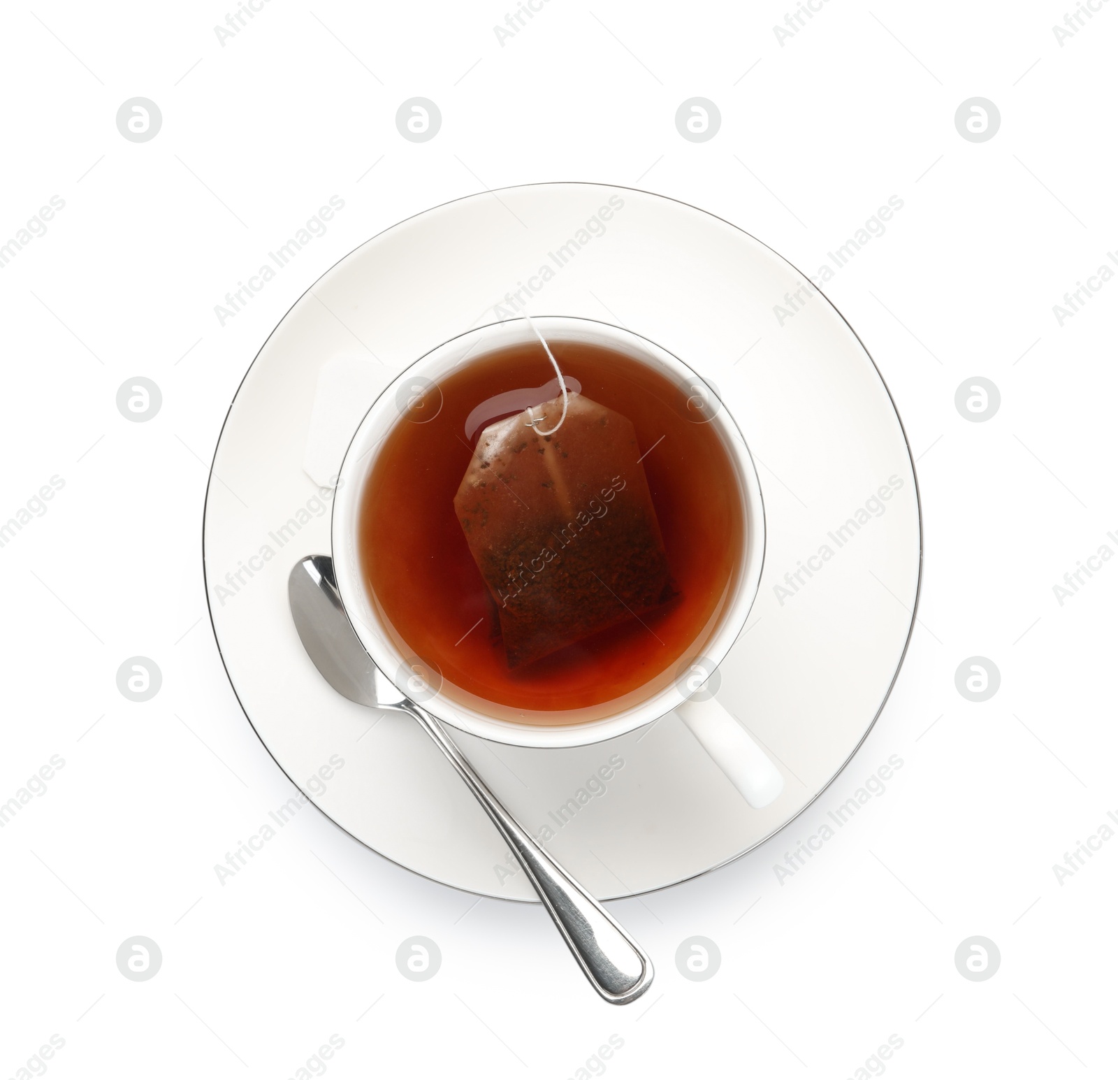 Photo of Tea bag in cup with hot drink isolated on white, top view