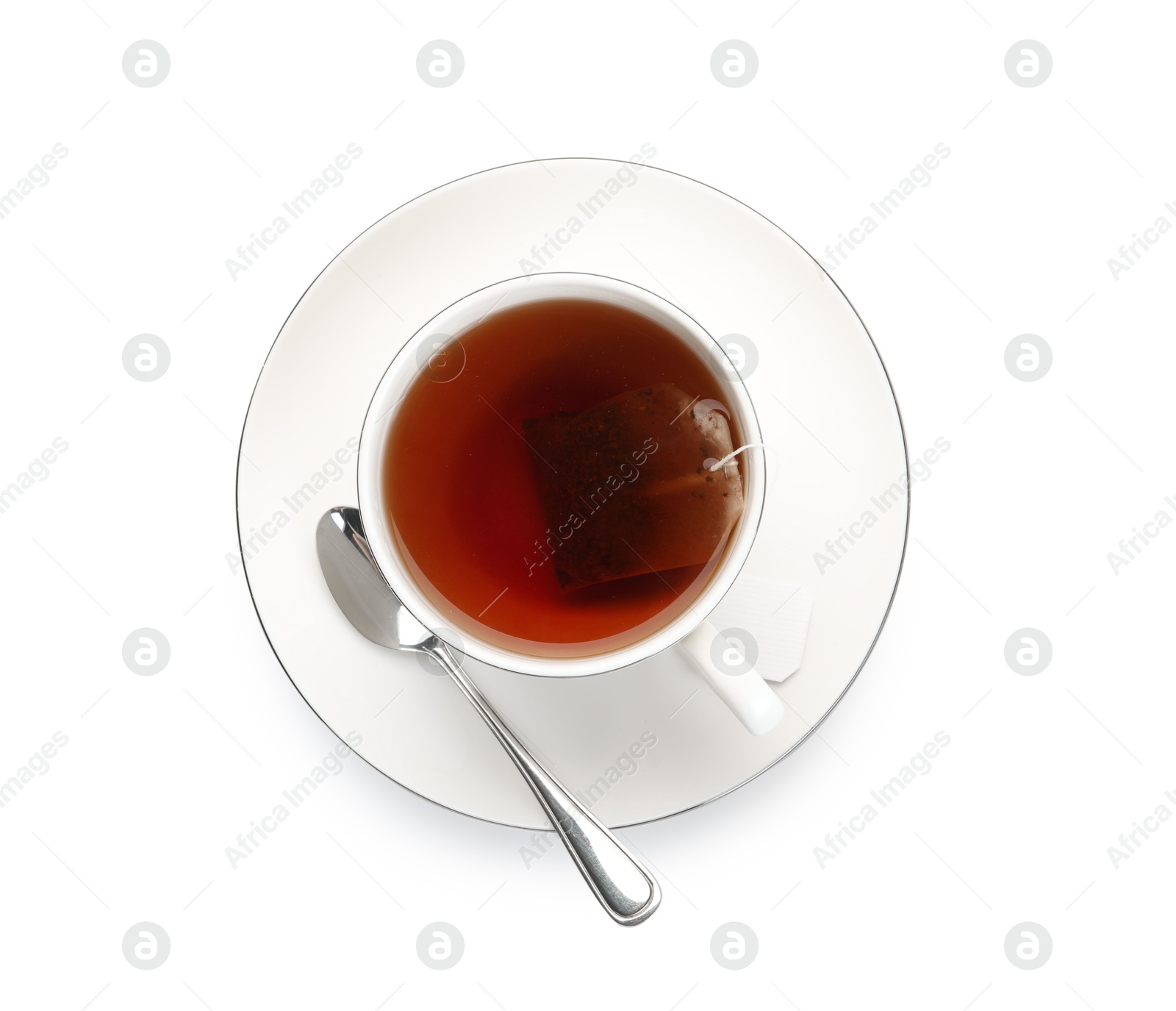 Photo of Tea bag in cup with hot drink isolated on white, top view