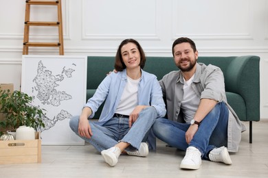 Photo of Happy couple in their new home on moving day