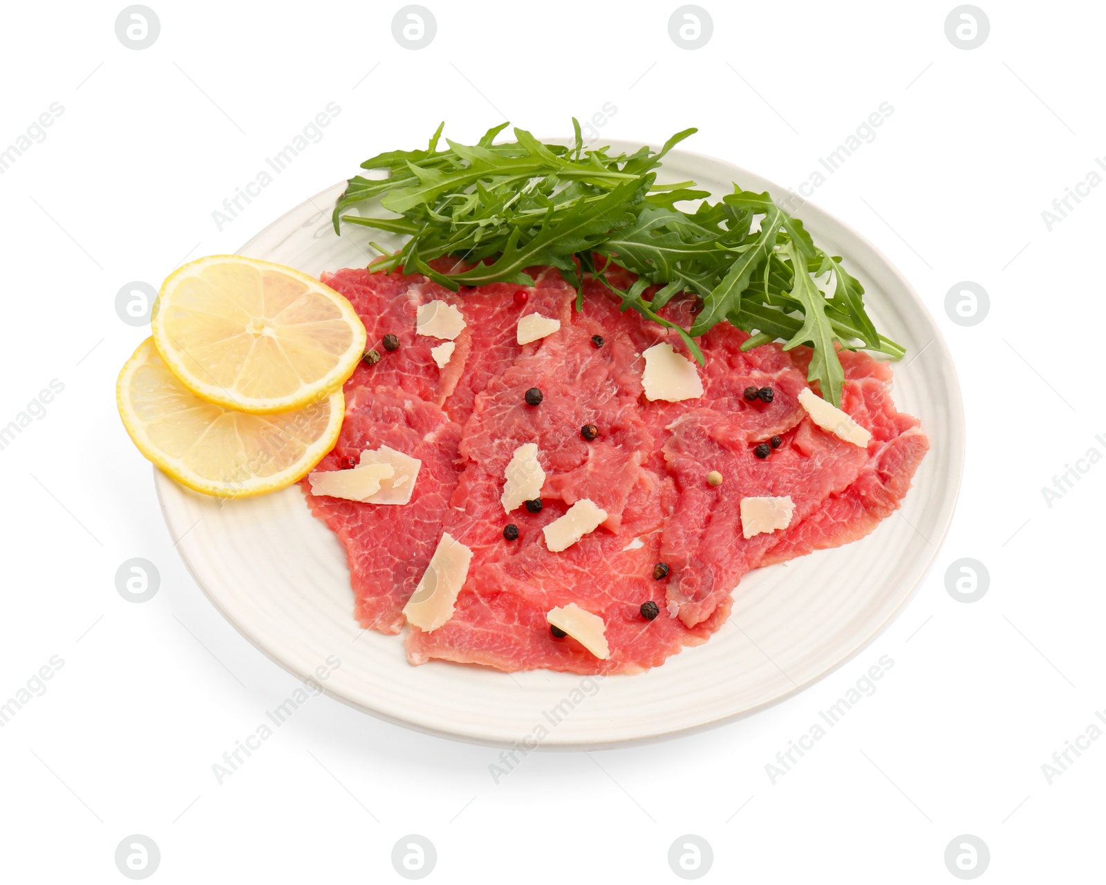 Photo of Fresh beef carpaccio with arugula, lemon and cheese isolated on white