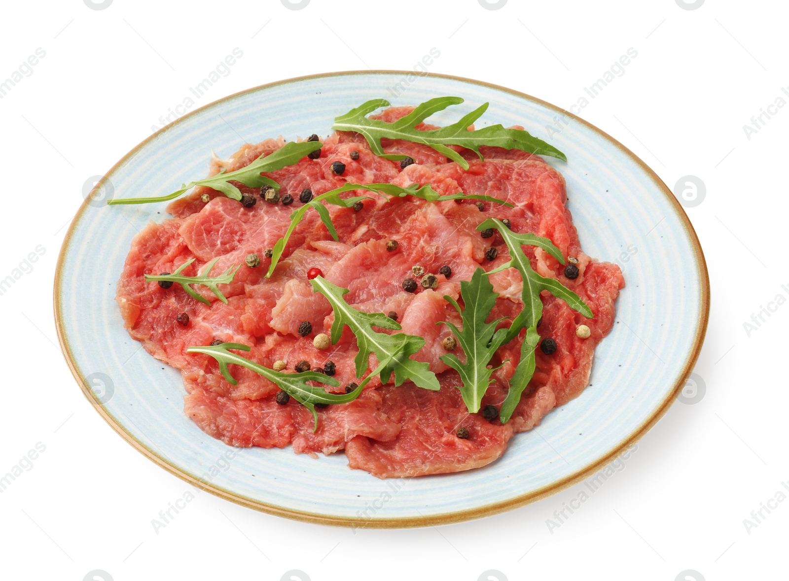 Photo of Fresh beef carpaccio with arugula and peppercorns isolated on white