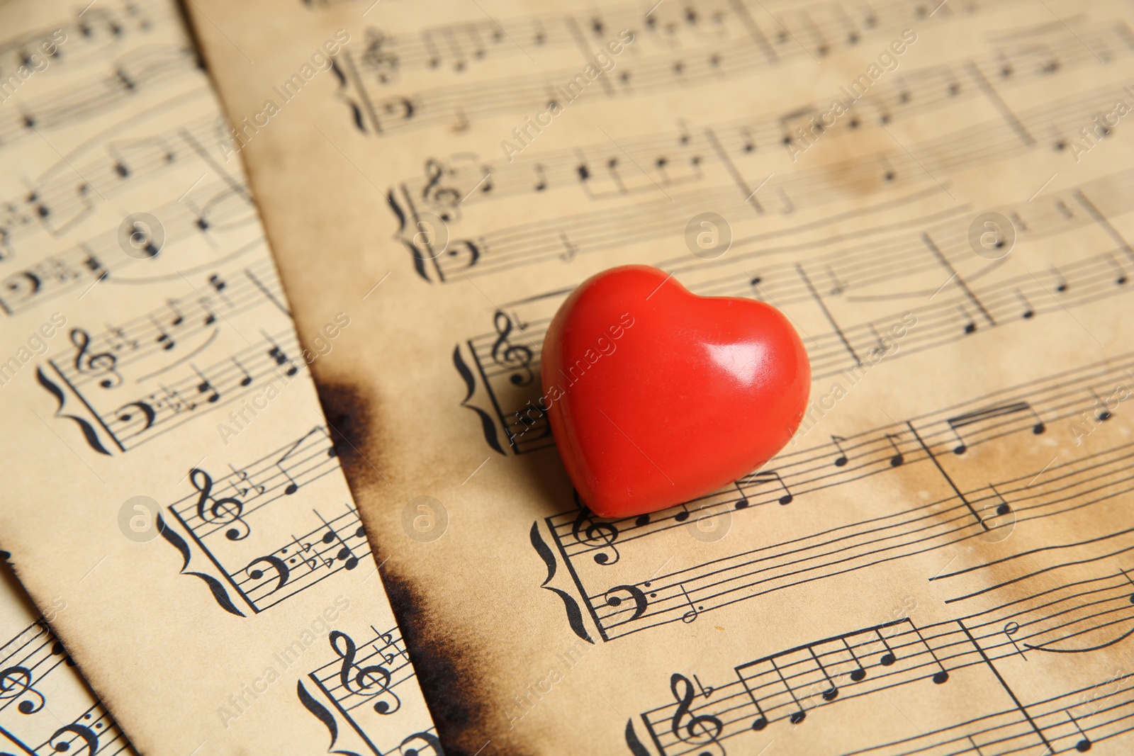 Photo of Heart figure on musical note sheets, closeup