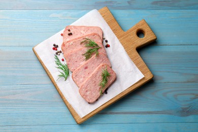 Photo of Pieces of tasty canned meat, dill and peppercorns on light blue wooden table, top view