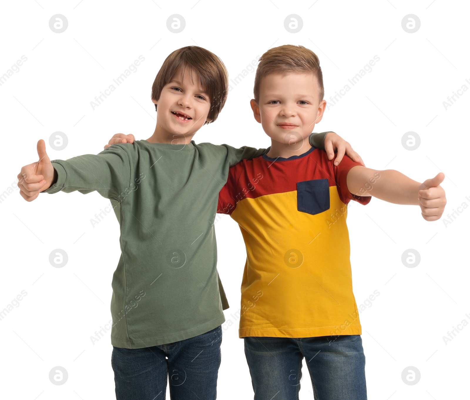 Photo of Cute brothers showing thumbs up on white background