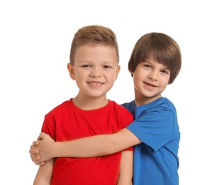 Photo of Portrait of cute brothers on white background