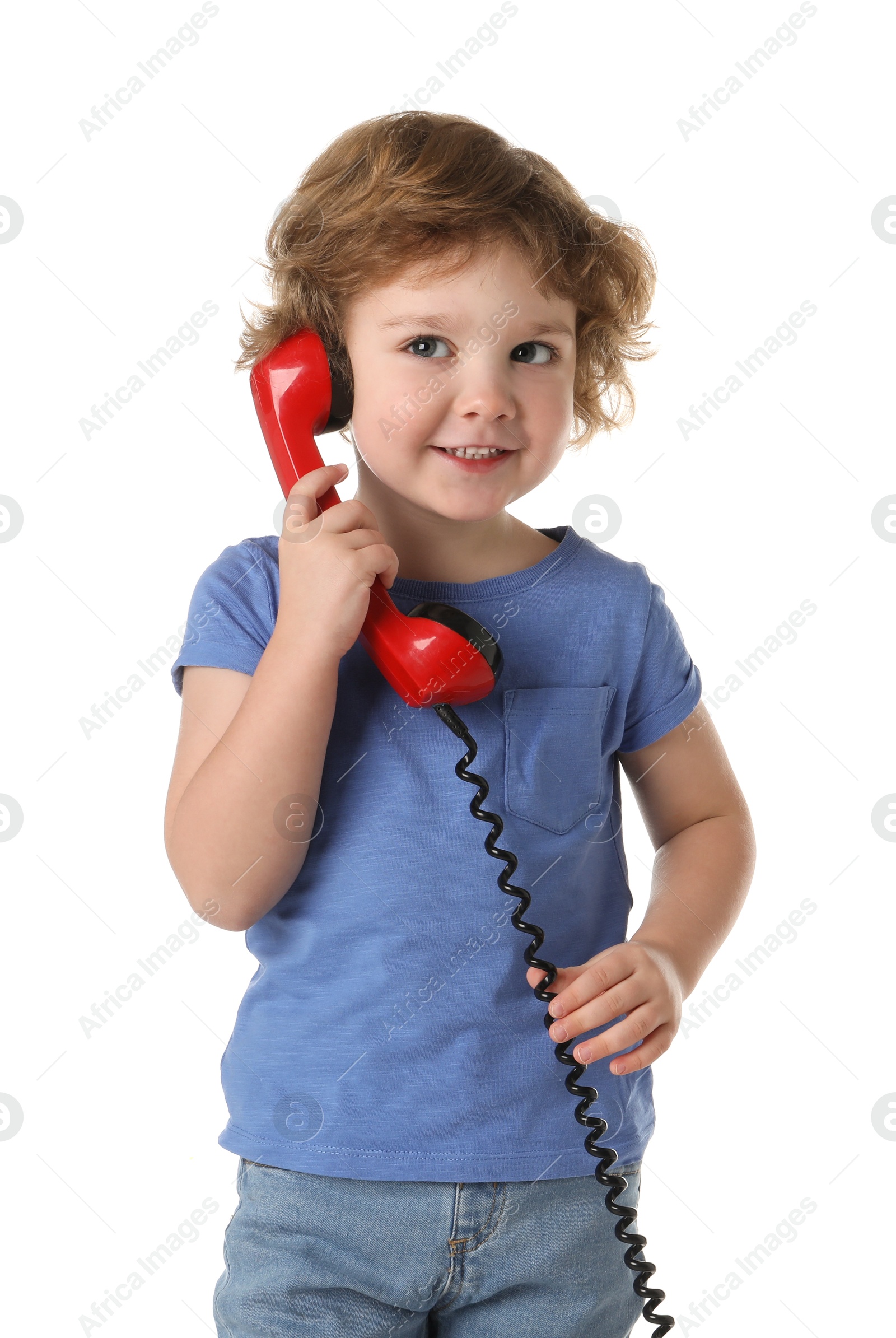 Photo of Cute little boy with telephone handset on white background